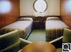 Two Beds Outside with Large Porthole