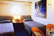 Two beds outside with window 